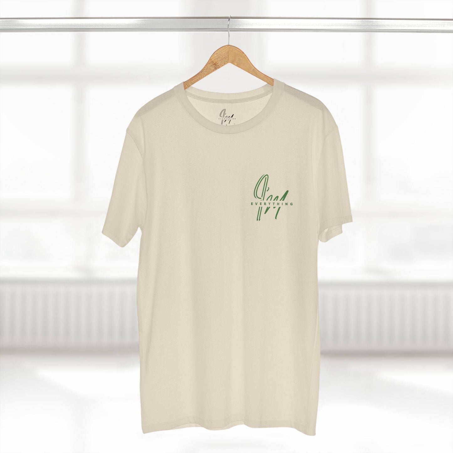 Empowering T-shirt in cream with green 'Empowering' script on chest, perfect for casual everyday wear and boosting confidence.
